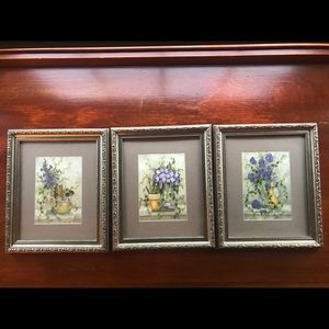 Used set of three bathroom pictures.